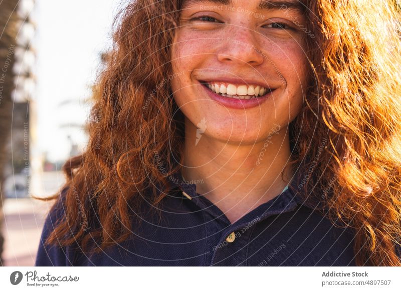 Happy Young Woman Looking at camera Redhead City Tshirt Standing Contemplation City Life Confidence Curly Hair Cool Beautiful Lifestyle Attitude Glance