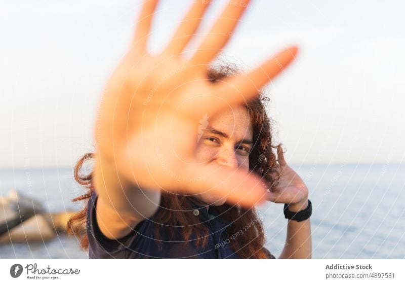 Smiling Woman Showing Stop Gesture Portrait Beach Sky Palm Closeup Sunlight Lifestyle Beautiful Leisure Attractive Positive Holiday Gesticulate Front View Hand