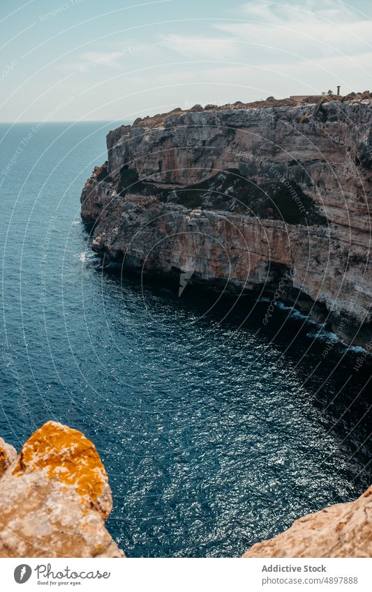 Picturesque seascape with massive rocky cliff in Mallorca landscape scenery nature formation seashore spectacular breathtaking ocean scenic mountain dwell