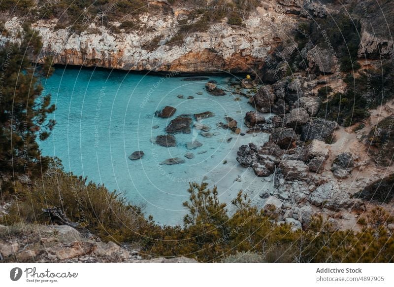 Picturesque seascape with massive rocky cliff in Mallorca landscape scenery nature formation seashore spectacular breathtaking ocean scenic mountain dwell