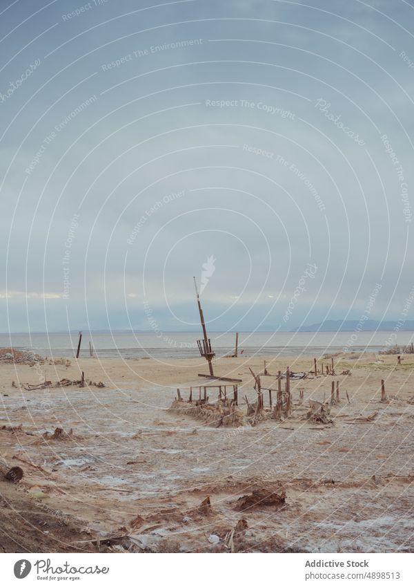 Sandy seacoast against cloudy sky seashore sand stormy gray arid weather summer endless bombay beach california usa united states america seaside landscape