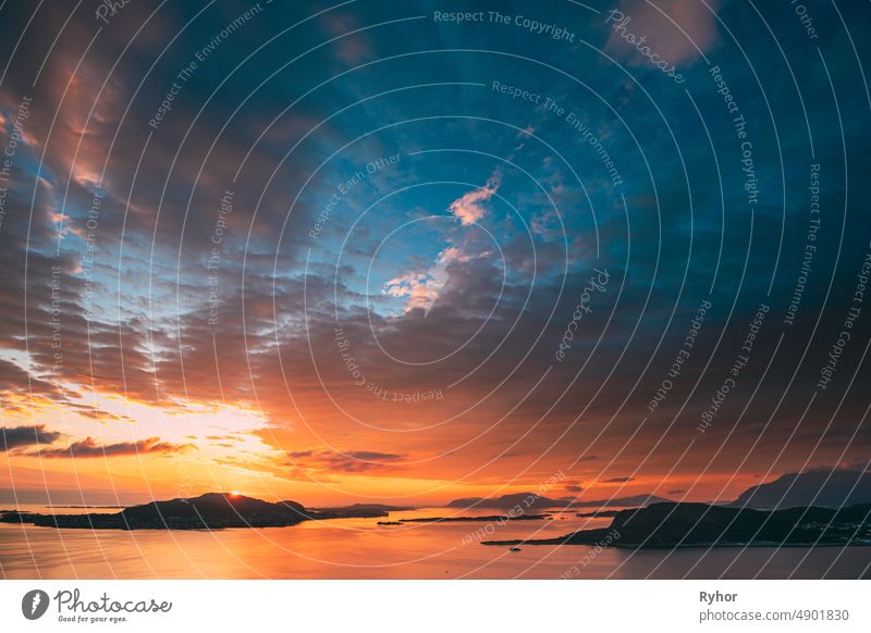 Alesund, Norway. Amazing Natural Bright Dramatic Sky In Warm Colours Above Alesund Valderoya And Islands In Sunset Sunrise Time. Colorful Sky Background. Beauty In Norwegian Nature