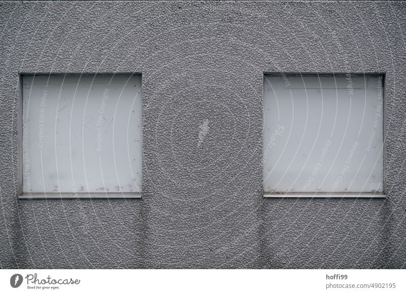 two closed shutters on a gray shabby facade Closed dreariness Facade Gray depression dejected Roller shutter Gloomy Window Building Wall (barrier)