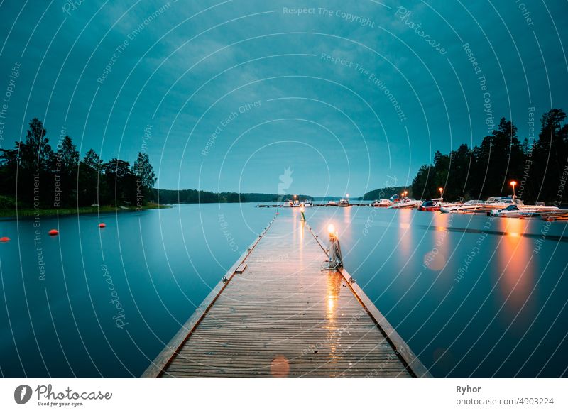 Sweden. Beautiful Wooden Pier Near Lake In Summer Evening Night. Lake Or River Landscape Swedish beautiful beauty in nature boat calm coast copy space europe