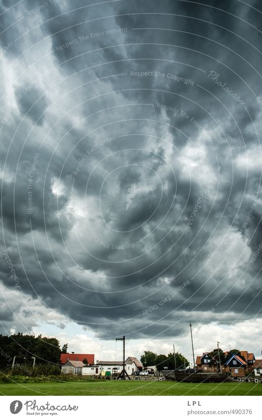 a storm gathers strength over a fishing village Elements Air Sky Clouds Storm clouds Bad weather Wind Gale Lithuania Village Fishing village