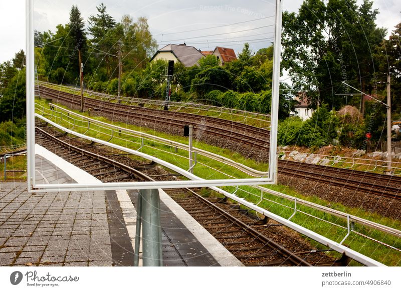 Rails in mirror Commuter trains Mirror Platform rails Train track Railroad Mirror image Rail transport Train station reflection Berlin city Germany Life Town