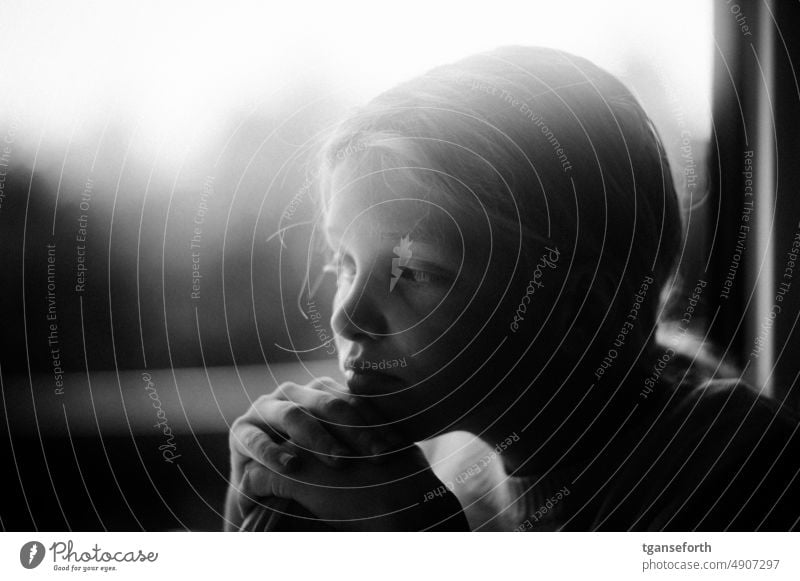 thoughtful child Child Meditative portrait Infancy Dreamily ponder Face Interior shot melancholically lost in thought Longing Daydreamer Intensive Girl Close-up