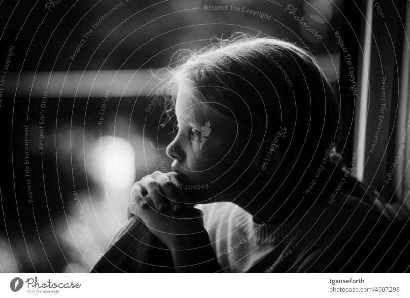 thoughtful child Child Meditative portrait Infancy Dreamily ponder Face Interior shot melancholically lost in thought Longing Daydreamer Intensive Girl Close-up