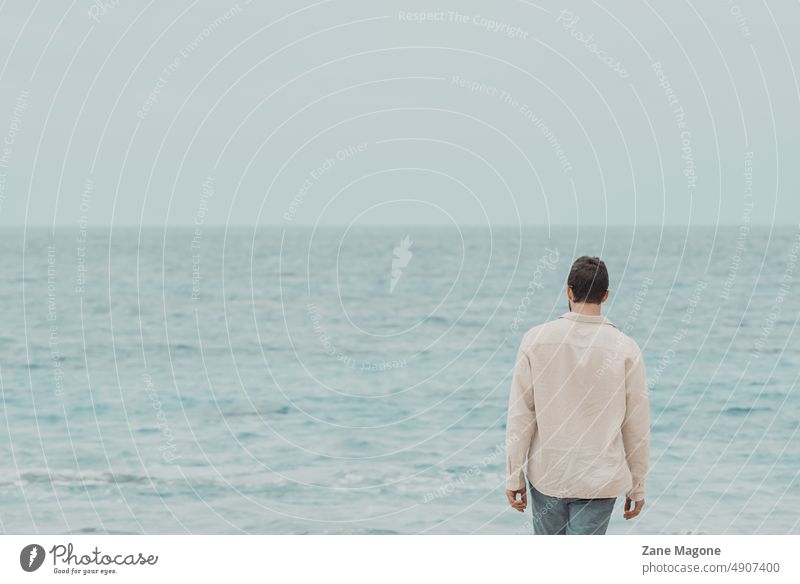 Man standing on the beach and looking at the ocean porto santo water sea summer sand sky people nature leisure vacation walking travel coast outdoors holiday