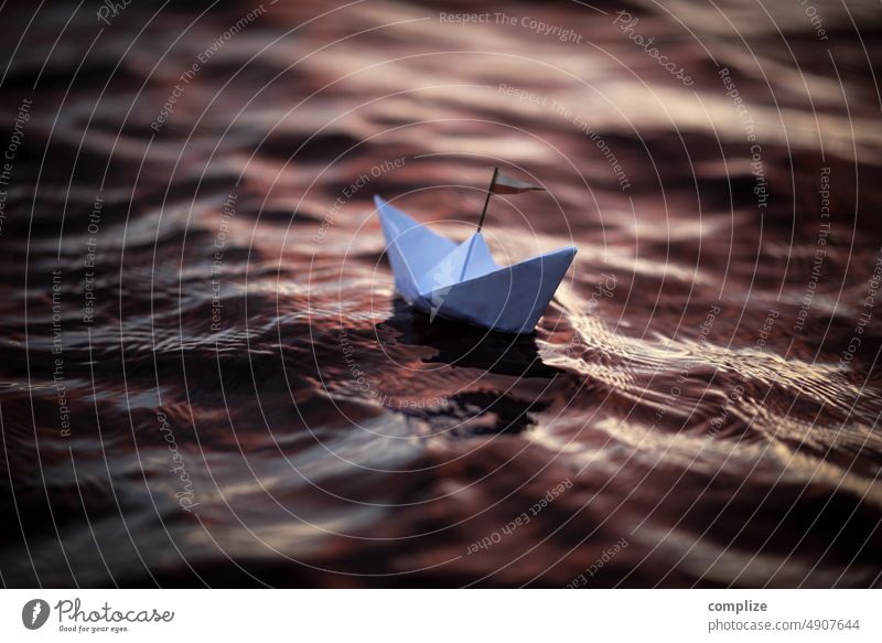 Paper ship at dusk on a lake lappajärvi Lake Paper boat Waves Sailing Sailboat Swell Sunset Romance vacation voyage travel Origami Handicraft Adventure children