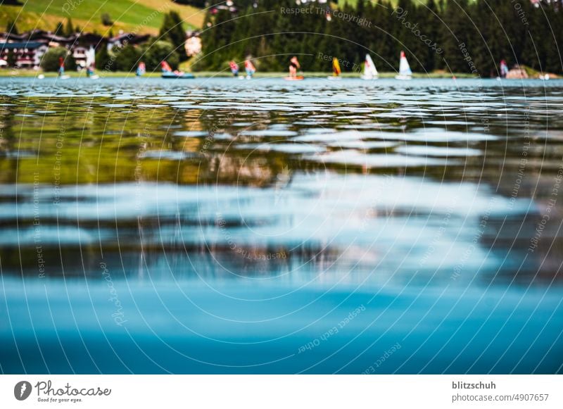 Mountain lake in Grisons, Switzerland watersports Aquatics Water Lake Surfing Blue mountain lake Nature Sports Tourism mountains suisa Suisse lenzerheide