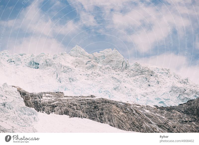 Jostedalsbreen National Park, Norway. Close Up View Of Melting Ice And Snow On Boyabreen Glacier In Summer Sunny Day. Famous Norwegian Landmark And Popular Destination. Close Up