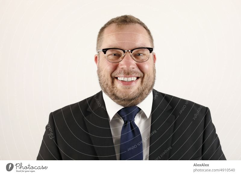 Portrait of man in suit with glasses smiling at camera. Profession Lifestyle Economy Office Work and employment Good pretty Upper body 35-50 years Interior shot