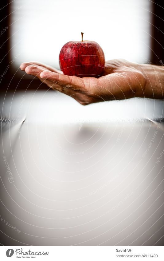 Man holding red apple in hand Apple salubriously vitamins fruit Hand stop Healthy Eating Food Expensive price Vegetarian diet food prices