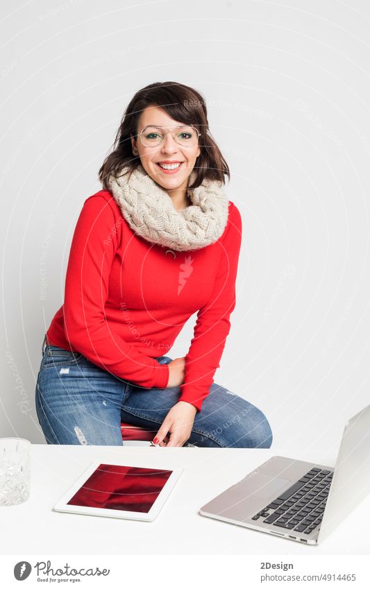 Senior business woman. Isolated over white background. looking at camera person laptop office computer portrait eyeglass sitting beautiful desk smiling