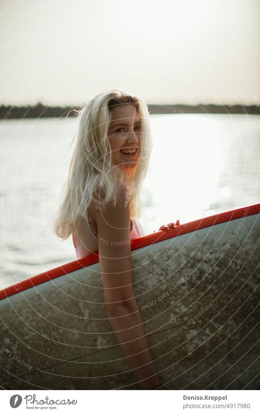 Woman with surfboard Face of a woman Woman's leg Girl power Idyll relaxed tranquillity relaxation Relaxation Summer free time holidays Joy Lifestyle pose Happy