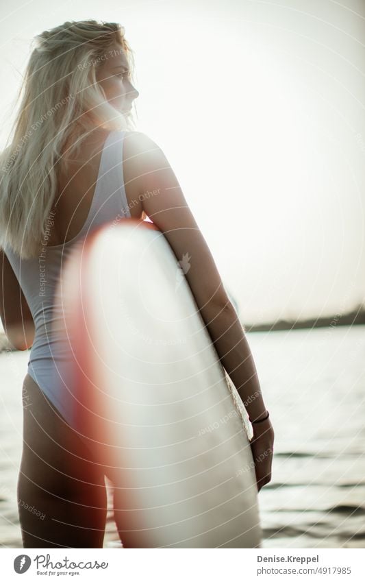 Woman with surfboard Face of a woman Woman's leg Girl power Idyll relaxed tranquillity relaxation Relaxation Summer free time holidays Joy Lifestyle pose Happy