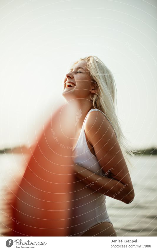 Woman with surfboard Face of a woman Woman's leg Girl power Idyll relaxed tranquillity relaxation Relaxation Summer free time holidays Joy Lifestyle pose Happy