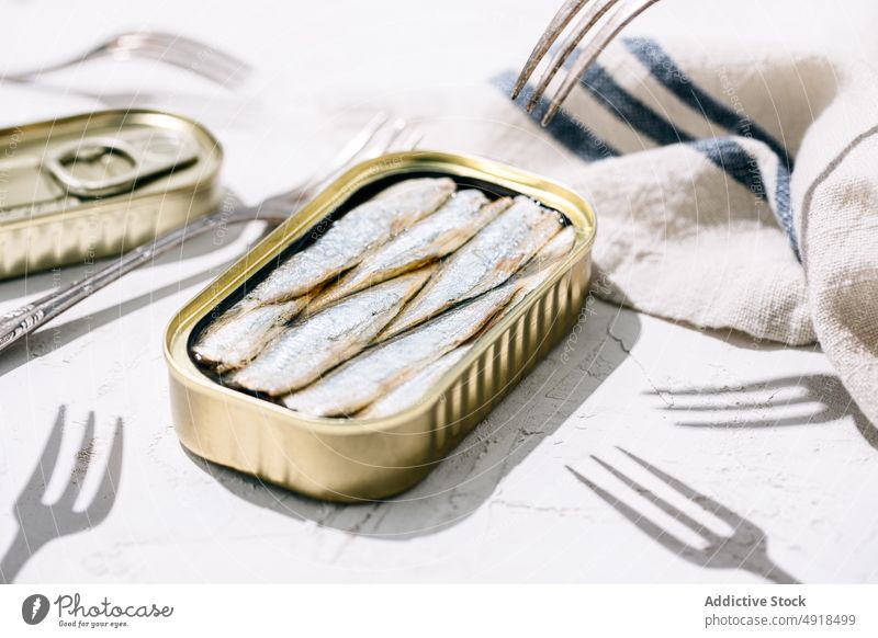 Closeup of a can of sardines metal tin conserve food seafood fish open metallic canned nutrition background isolated preserve product meal snack seal container