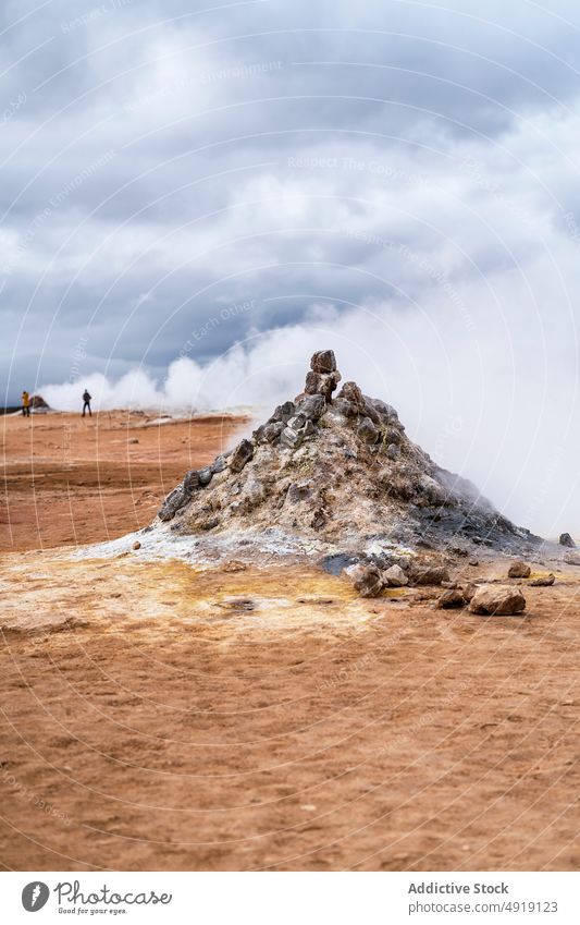 Scenic landscape of steaming fumaroles in volcanic terrain thermal traveler nature geothermal geyser tourism explore geology namafjall iceland hot scenery wild