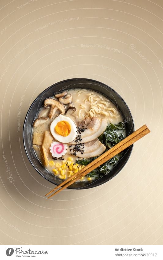 Tasty ramen with mushrooms and egg japanese noodle traditional culture dish ingredient flavor food meal bowl chopstick yummy appetizing delectable tasty serve