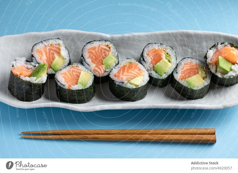 Delicious Futomaki Norwegian rolls with salmon japanese sushi futomaki norwegian set avocado seafood fish traditional chopsticks culture dish rice meal yummy