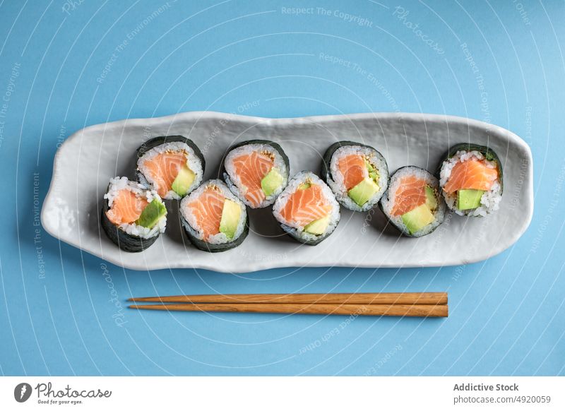 Delicious Futomaki Norwegian rolls with salmon japanese sushi futomaki norwegian set avocado seafood fish traditional chopsticks culture dish rice meal yummy