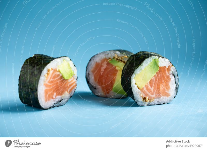 Futomaki Norwegian sushi roll with salmon japanese futomaki asian food norwegian avocado seafood fish traditional ingredient light delicacy studio culture dish