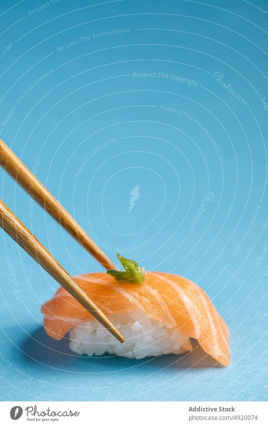 Norwegian nigiri with salmon and wasabi japanese norwegian chopstick sushi asian food seafood fish rice traditional slice utensil flavor ingredient light