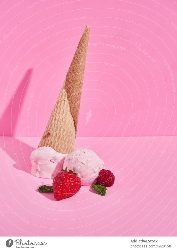 Fallen strawberry ice cream cones waffle flavor sweet dessert treat fallen ingredient ball food delicious cold scoop appetizing tasty yummy crunch calorie