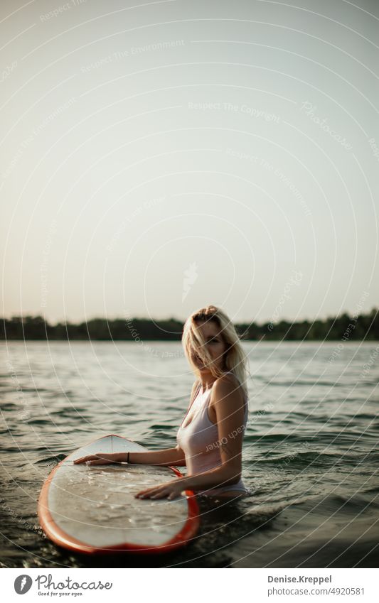 Woman on surfboard Face of a woman Woman's leg Girl power Idyll relaxed tranquillity relaxation Relaxation Summer free time holidays Joy Lifestyle pose Happy