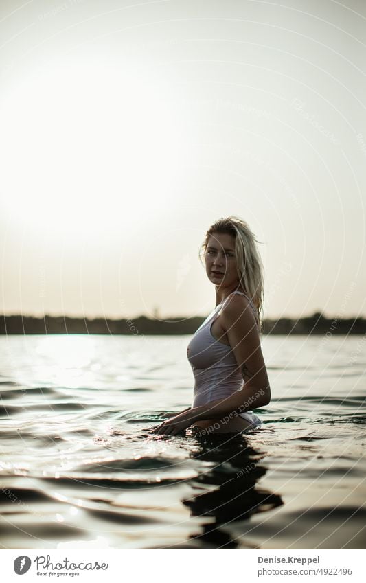 Woman at the lake Face of a woman Woman's leg Girl power Idyll relaxed tranquillity relaxation Relaxation Summer free time holidays Joy Lifestyle pose Happy