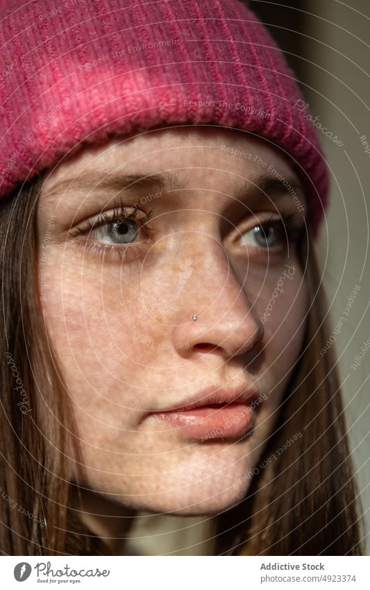 Woman with shadow of curtain on face woman portrait sunlight appearance hat peaceful dreamy shade tranquil serene style room feminine wistful sunshine female