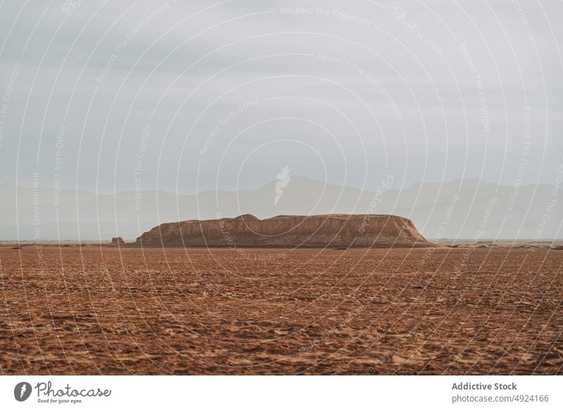 Sandstone cliff in picturesque desert in daytime formation sand nature landscape valley scenery sandstone rocky terrain geology scenic wild cloudy sky tourism