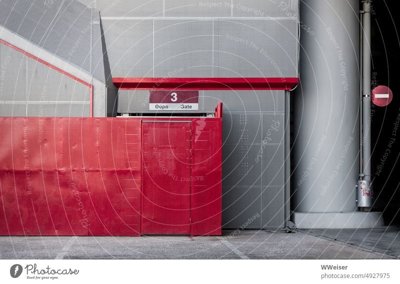 It's all just a facade: a composition of perforated sheeting in gray and red Facade Stadium Tin Metal Plate with holes Gray Red Wall (building) Fence