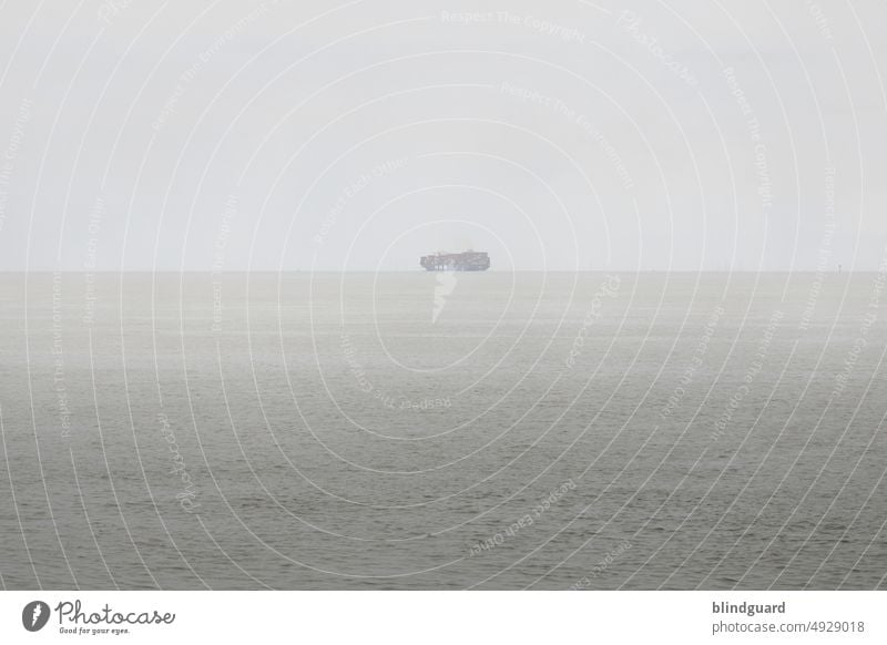 When the sea and sky merge in the mist ship Container ship Logistics Navigation Exterior shot Trade Colour photo North Sea Water Watercraft Deserted