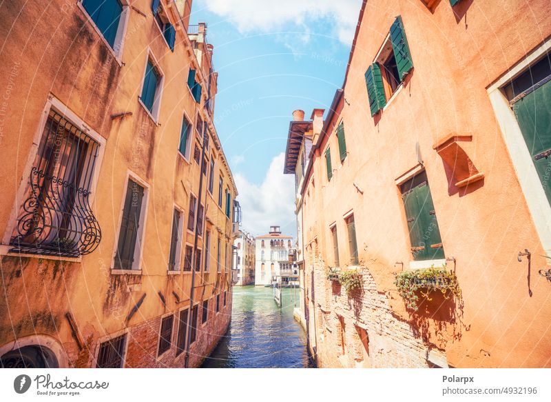 Small water passage in Venice, Italy view antique entrance bridge stone outdoor wooden tourist mediterranean traditional home urban street beautiful venetian