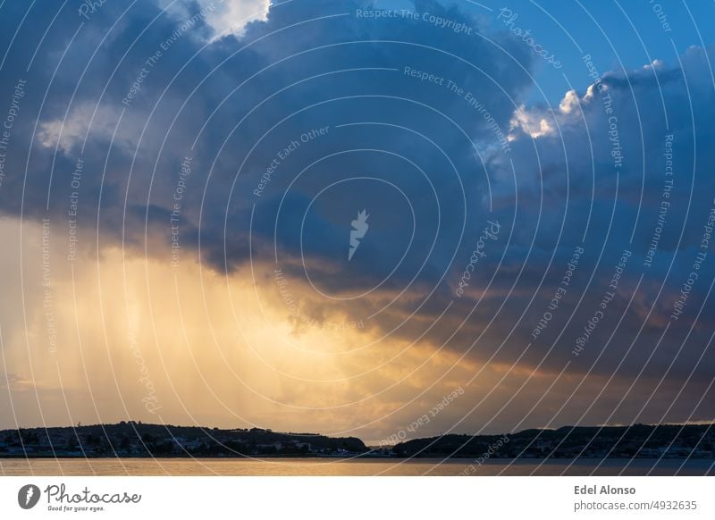 raining over the city, golden sunlight over the sea, mountains in the horizon. Landscape longexposure colorful sunsetlovers outdoor grass cloud green winter