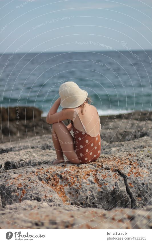 wander far and wide Rock rocky coast Ocean Water Blue Turquoise clear Girl Hat Swimsuit points Spotted Beige pretty Easygoing Nonchalance Freedom on one's own