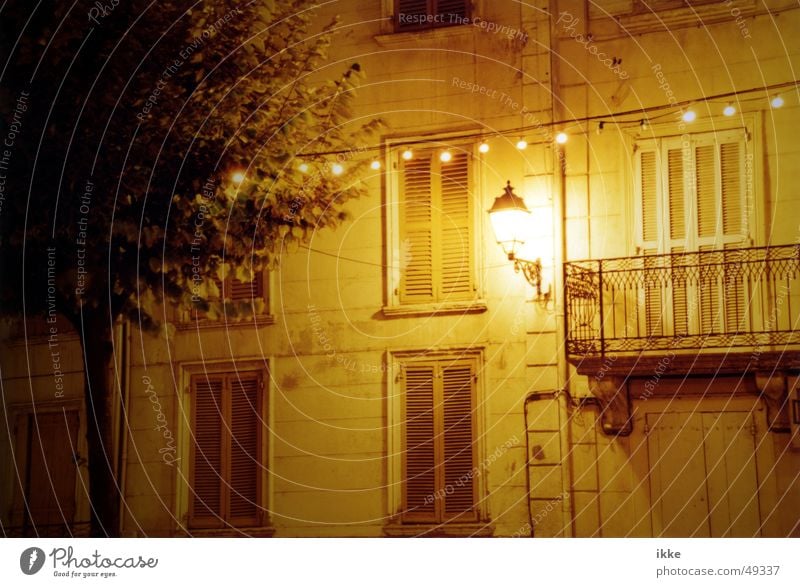 Provence Light Lantern Night Fairy lights Balcony House (Residential Structure) Lamp Night shot Window Shutter Facade Handrail Exterior lighting Yellow Sleep