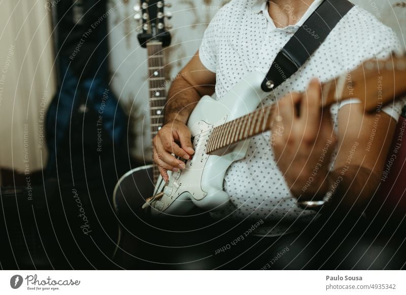 Man playing electric guitar Music Musician Musical instrument Guitar Guitarist Guitar string Make music Musical instrument string Sound Leisure and hobbies