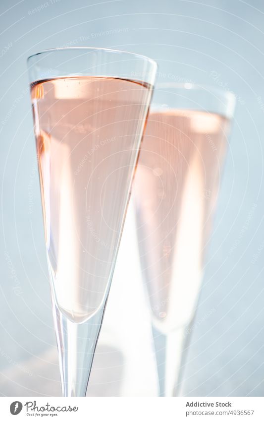 Champagne glasses on light background alcohol beverage champagne cocktail cold couple crystal drink gourmet minimalism pair pink rose sparkling stone white wine