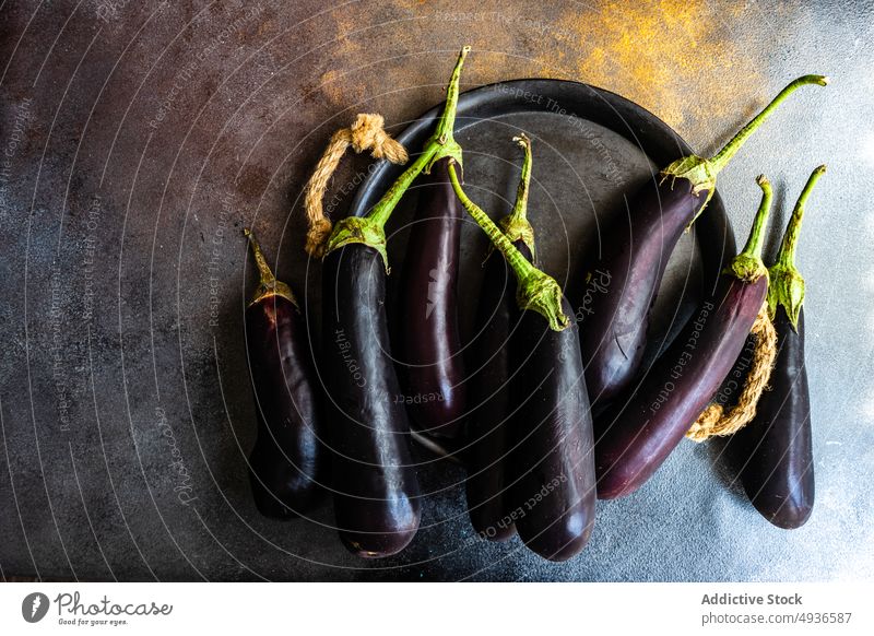 Organic vegetable frame eggplant cook diet healthy ingredient organic plant based vegan plate purple green vegetarian eggplants ripe fresh rustic food raw