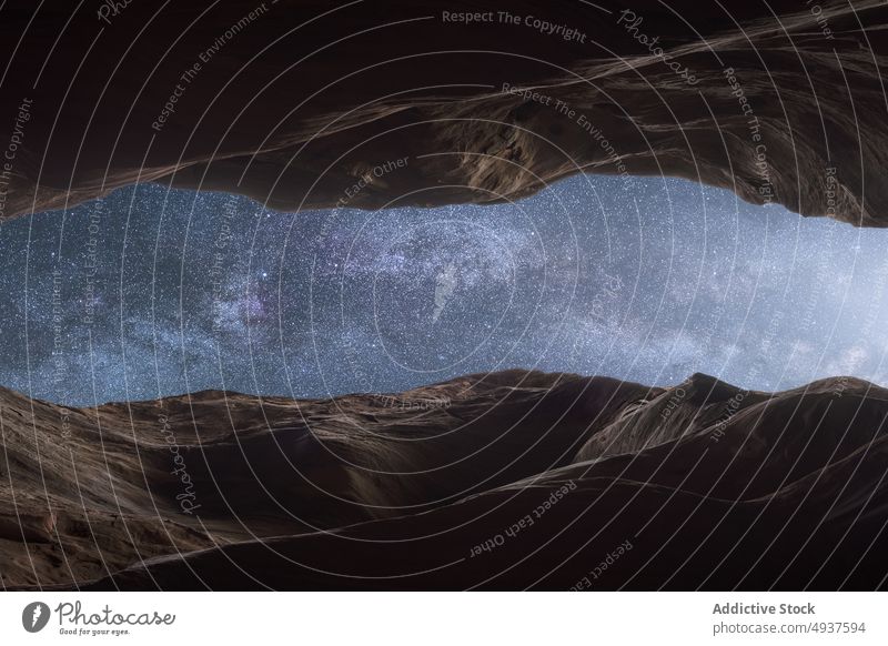 Starry sky over ravine at night rock cliff starry formation rough countryside stone wall canyon nature narrow terrain geology spectacular calm peaceful evening