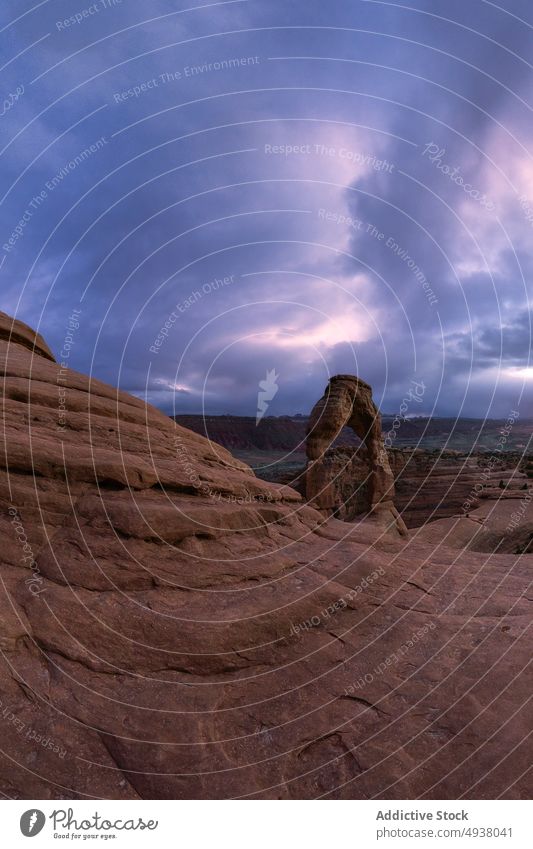 Stone arch and canyon against sunset sky stone cloudy nature breathtaking formation picturesque delicate arch arches national park moab utah usa united states