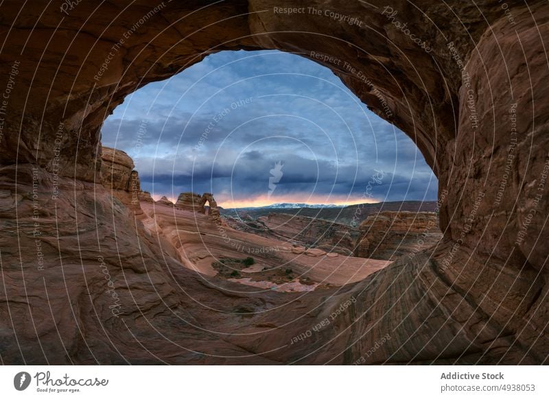 Stone arch and canyon against sunset sky stone cloudy nature breathtaking formation picturesque delicate arch arches national park moab utah usa united states