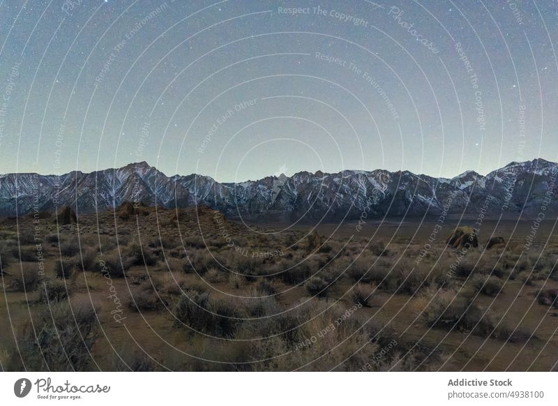 Mountains and dry valley against starry sky mountain bush night ridge countryside landscape lone pine alabama hills california usa united states america range