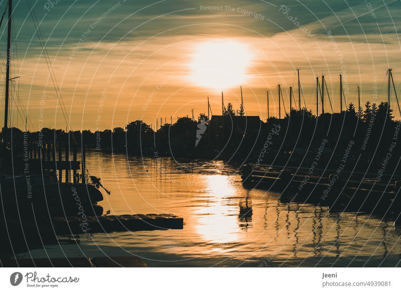 Sunset at small harbor Harbour Fishing boat Water River Lake Ocean Navigation coast Sky Evening Dusk Light Horizon reflection Twilight Bay Calm boats mast