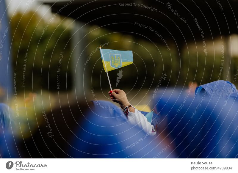 Hand holding ukrainian flag Flag Ukraine Ukrainian Solidarity Blue ukraine war Politics and state symbol Ukrainian flag Sign nation peace Peace Yellow Russia