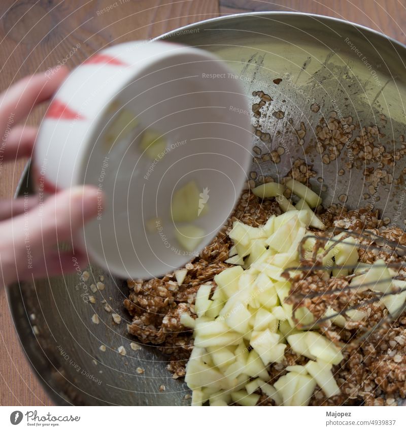 Unrecognizable person mixing ingredients for healthy cookies cuisine closeup apple - fruit baking baking sheet bowl chopped food cooking cooking utensil